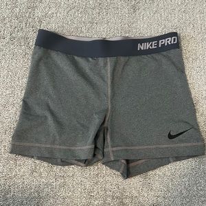 Grey Nike pro shorts.